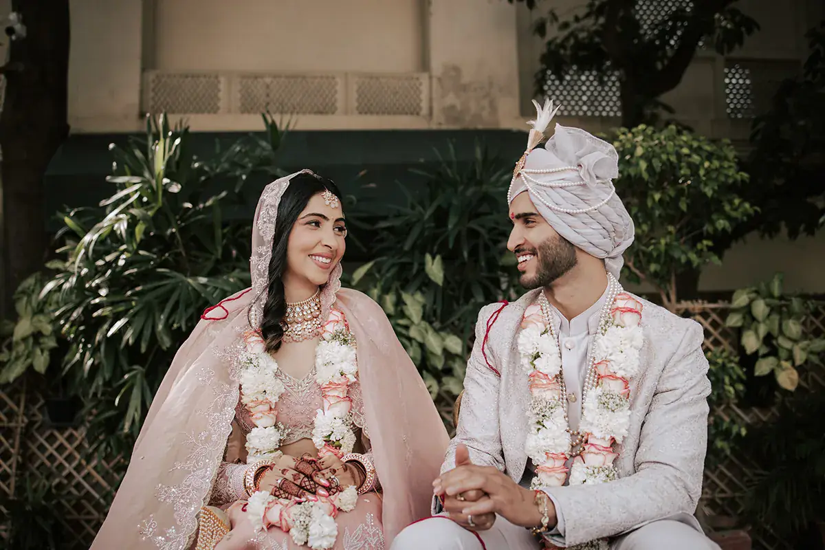 Abhinav and Chitrika seated with their garlands