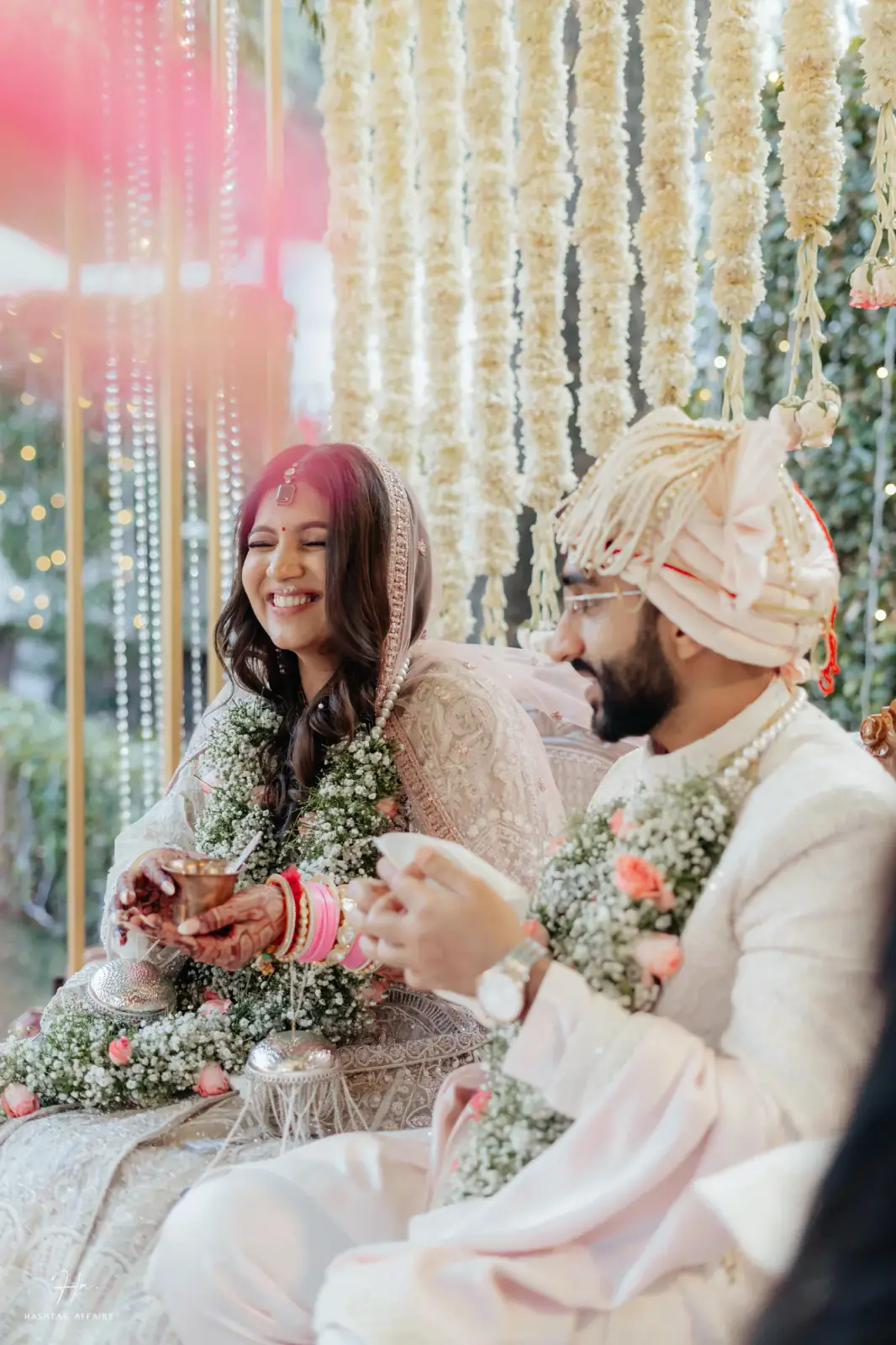 Bride and groom laughing together during the ceremony