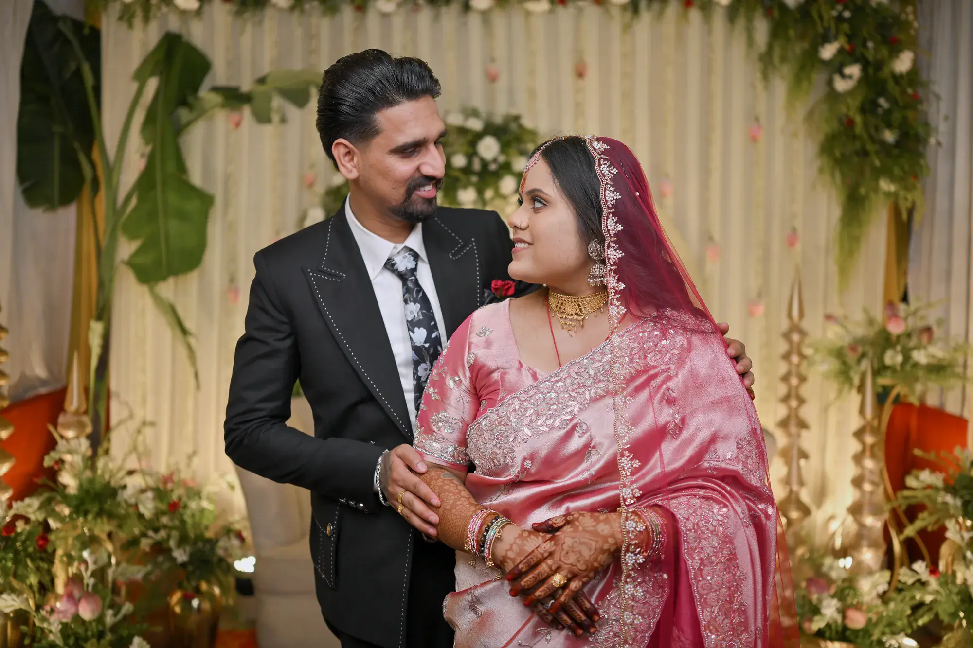 Manisha and Sumit smiling at each other at their engagement