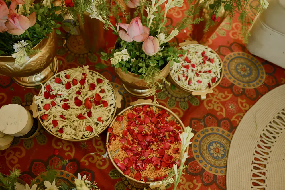 Petal platters on a patterned carpet, seen from above