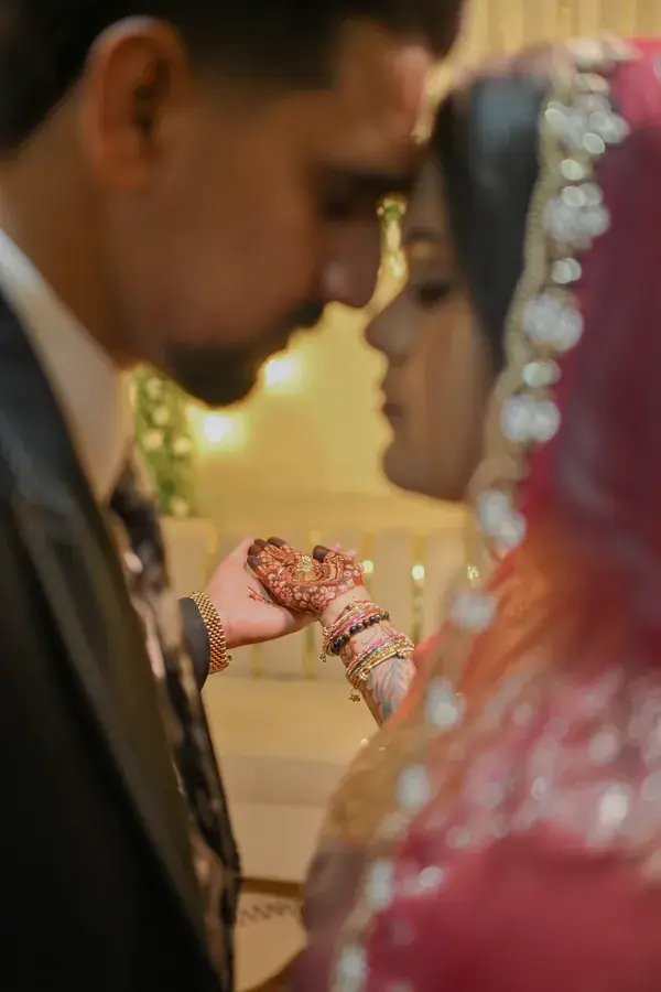 Manisha and Sumit close together, holding hands