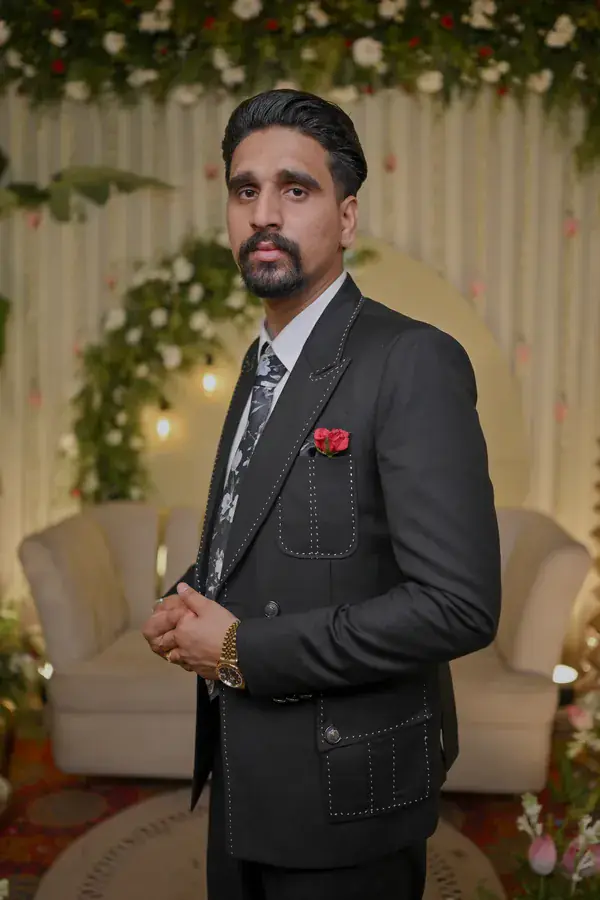 Sumit on the stage in his suit